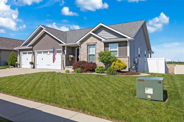 536 W 5th St, Saint Jacob, IL 62281 - craftsman house with board and batten siding, stone siding, an attached garage, concrete driveway, and a shingled roof