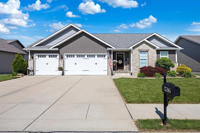 536 W 5th St, Saint Jacob, IL 62281 - craftsman house with a garage, stone siding, board and batten siding, driveway, and a front yard