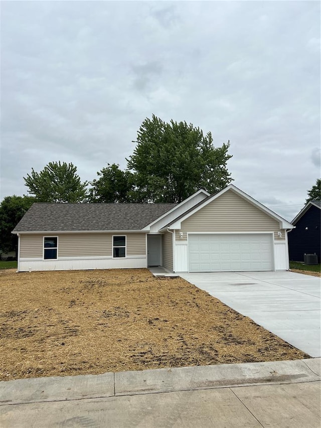 10 Jaybird Ct, Montgomery City, MO 63361 - ranch-style house featuring concrete driveway, a garage, and central AC unit