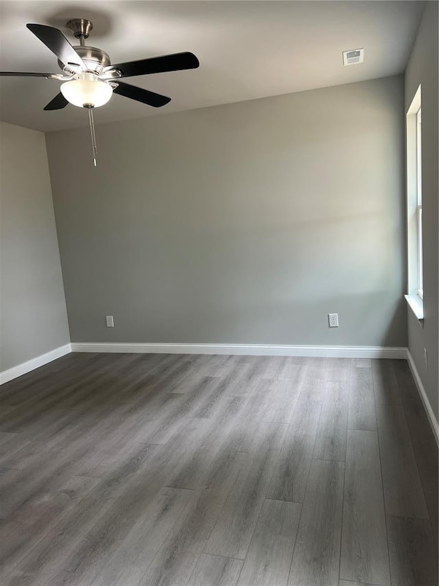 10 Jaybird Ct, Montgomery City, MO 63361 - unfurnished room with ceiling fan, dark wood-style flooring, and baseboards