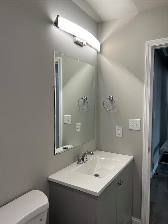 10 Jaybird Ct, Montgomery City, MO 63361 - half bathroom with vanity, toilet, and wood finished floors