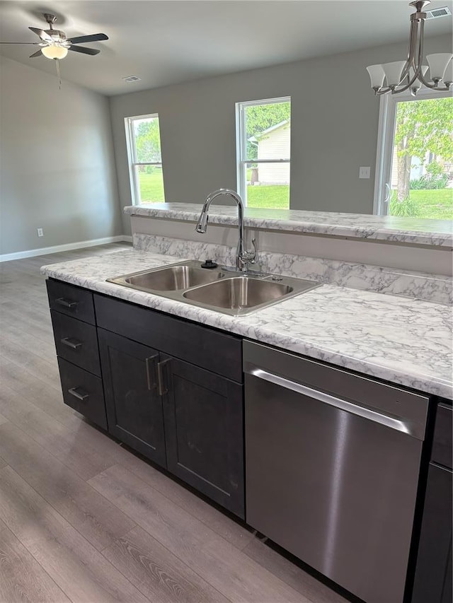 10 Jaybird Ct, Montgomery City, MO 63361 - kitchen featuring dishwasher, light wood-style floors, a sink, and plenty of natural light