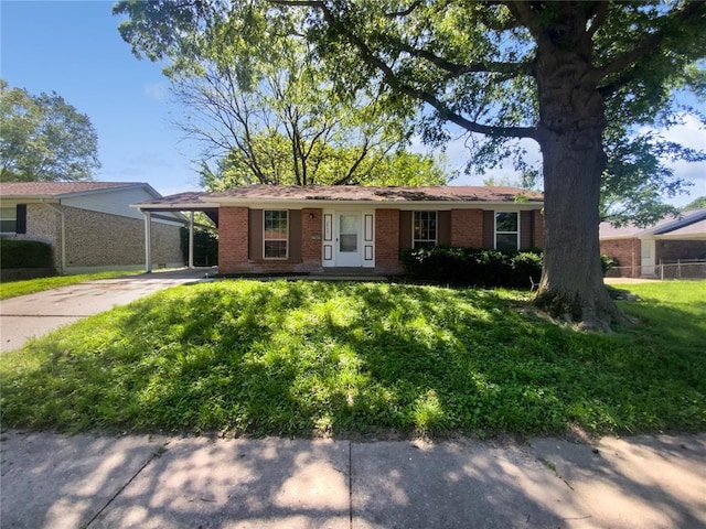 2540 Courtyard Pl, Florissant, MO 63031 - single story home with brick siding, concrete driveway, and a carport