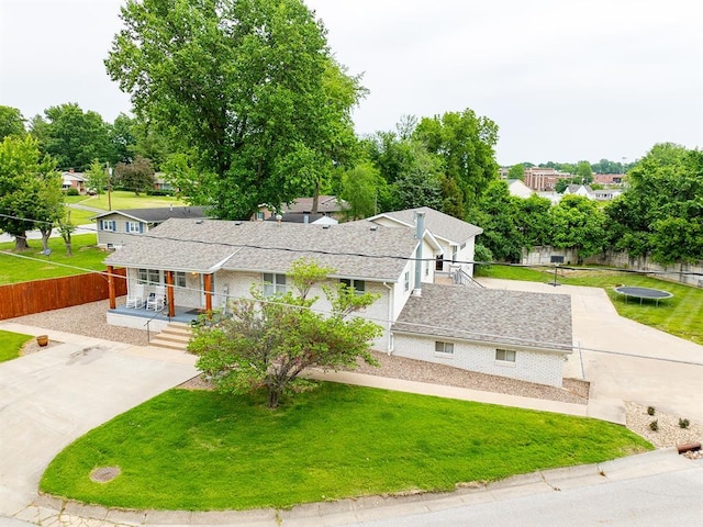 3930 Commanche Ave, Hannibal, MO 63401 - view of front of property featuring a porch, a shingled roof, brick siding, and a residential view