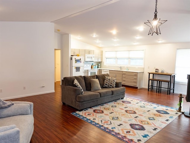 3930 Commanche Ave, Hannibal, MO 63401 - living area featuring lofted ceiling, dark wood-style flooring, and baseboards