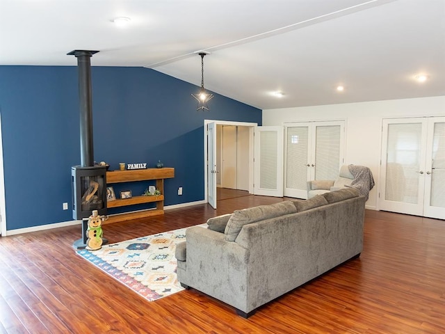 3930 Commanche Ave, Hannibal, MO 63401 - living room with french doors, lofted ceiling, wood finished floors, baseboards, and recessed lighting