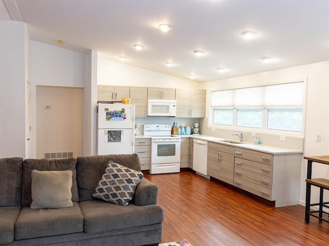 3930 Commanche Ave, Hannibal, MO 63401 - kitchen featuring white appliances, open floor plan, light countertops, a sink, and lofted ceiling