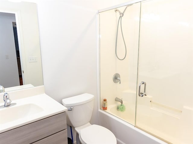 3930 Commanche Ave, Hannibal, MO 63401 - full bathroom featuring vanity, toilet, and shower / bath combination with glass door
