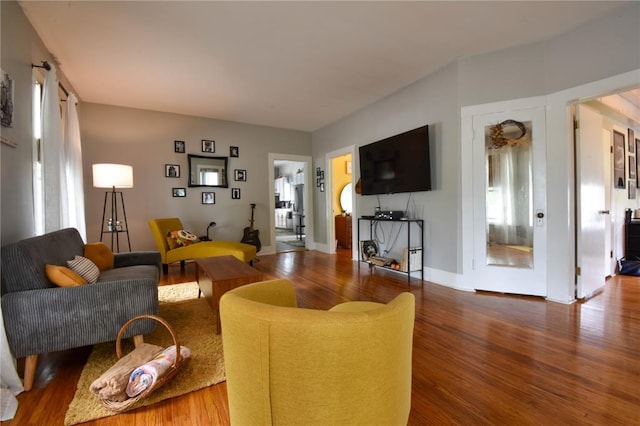 living area featuring wood finished floors and healthy amount of natural light