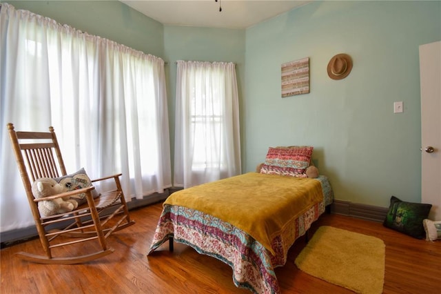 bedroom with wood finished floors