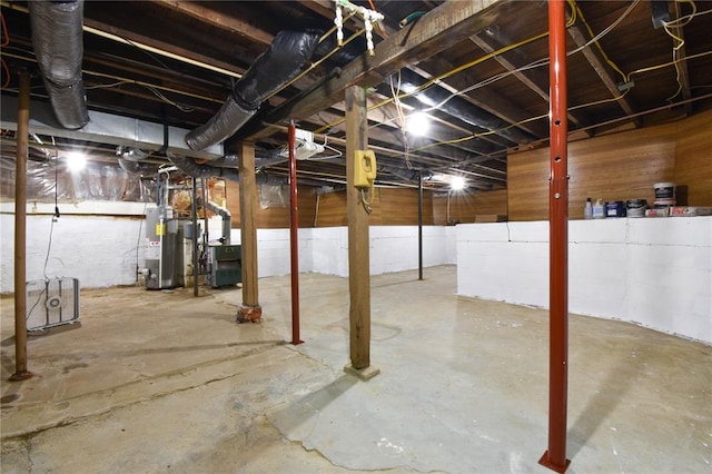unfinished basement with gas water heater