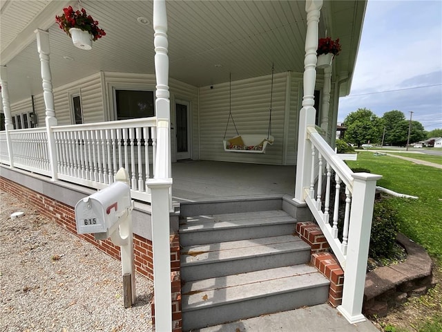 entrance to property with covered porch