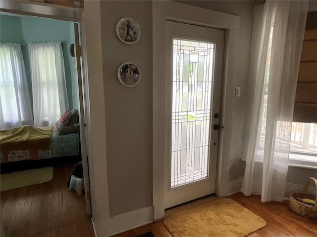 doorway featuring wood finished floors