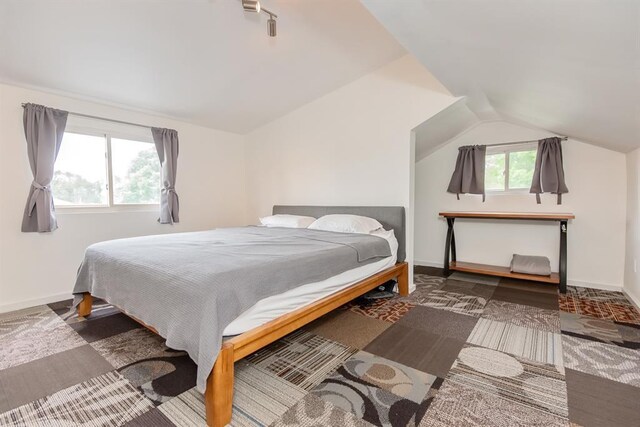 5156 Christy Ave, Saint Louis, MO 63116 - bedroom with lofted ceiling and baseboards