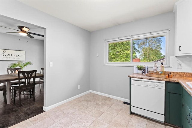 kitchen with dishwasher, light countertops, ceiling fan, baseboards, and green cabinetry