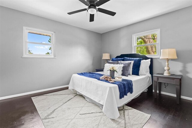 bedroom with baseboards, a ceiling fan, and wood finished floors