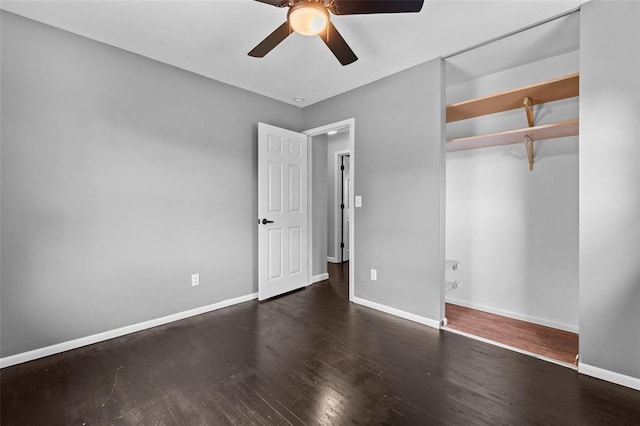 unfurnished bedroom featuring wood finished floors, baseboards, and a ceiling fan