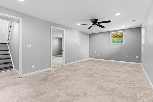empty room with recessed lighting, stairs, ceiling fan, and baseboards