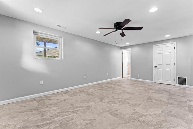 empty room with recessed lighting, a ceiling fan, and baseboards