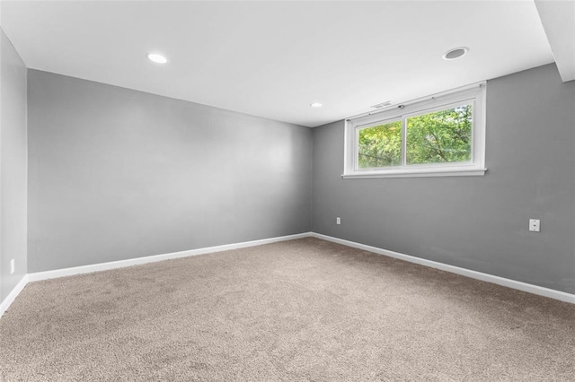 unfurnished room with carpet flooring, baseboards, and recessed lighting