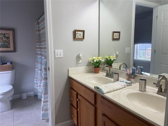 835 Bay Hill Blvd, Union, MO 63084 - full bathroom featuring toilet, double vanity, tile patterned flooring, and baseboards