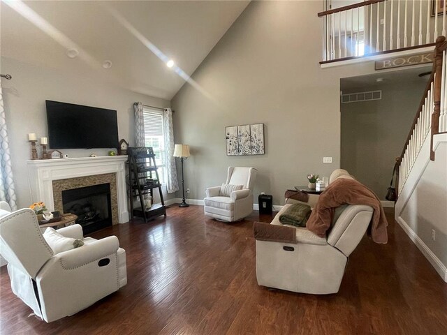 835 Bay Hill Blvd, Union, MO 63084 - living room with high vaulted ceiling, stairs, baseboards, wood finished floors, and a fireplace