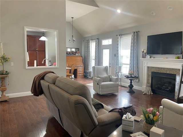 835 Bay Hill Blvd, Union, MO 63084 - living room featuring baseboards, dark wood-style floors, lofted ceiling, and a fireplace