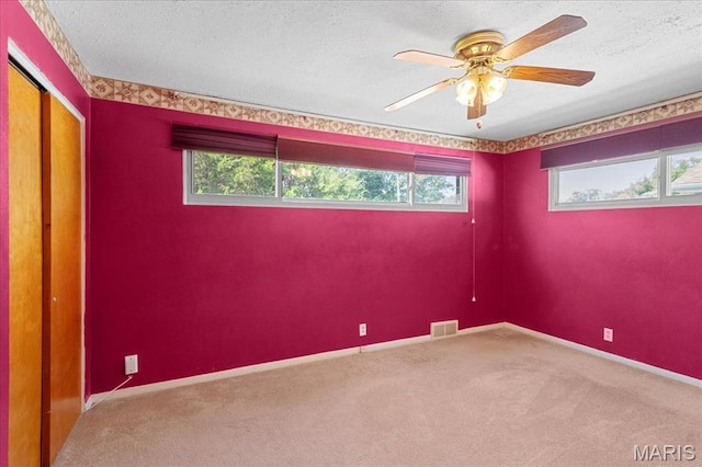 1816 N Belt, Belleville, IL 62221 - spare room featuring carpet flooring, a ceiling fan, and a textured ceiling