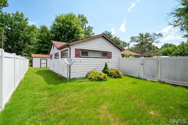 1816 N Belt, Belleville, IL 62221 - view of side of home with a fenced backyard, a gate, and a shed