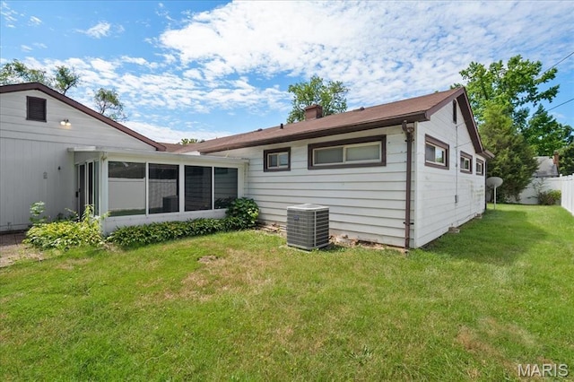 1816 N Belt, Belleville, IL 62221 - back of house with a sunroom and a chimney