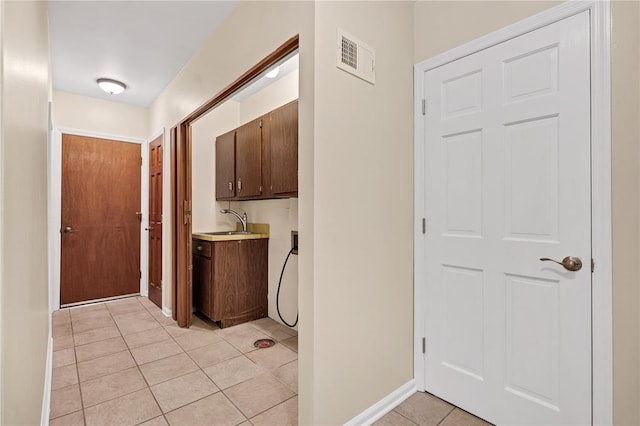 9216 Matthews Ln, Sunset Hills, MO 63127 - hallway with a sink, light tile patterned floors, and baseboards
