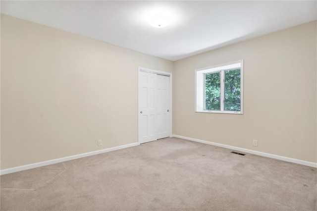9216 Matthews Ln, Sunset Hills, MO 63127 - spare room featuring baseboards and light carpet
