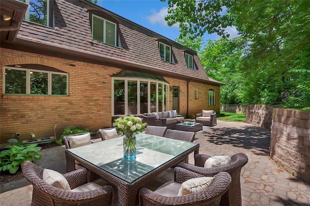 9216 Matthews Ln, Sunset Hills, MO 63127 - view of patio featuring an outdoor hangout area and outdoor dining space
