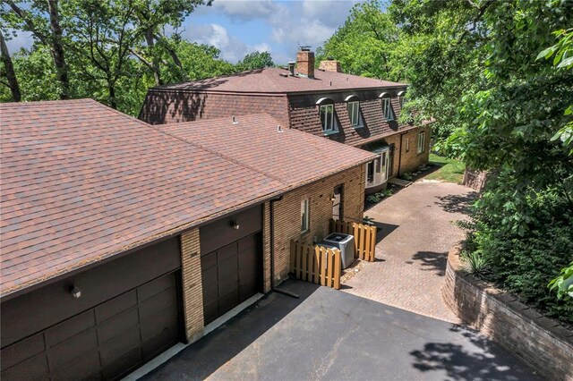 9216 Matthews Ln, Sunset Hills, MO 63127 - view of front of house featuring a chimney and a shingled roof