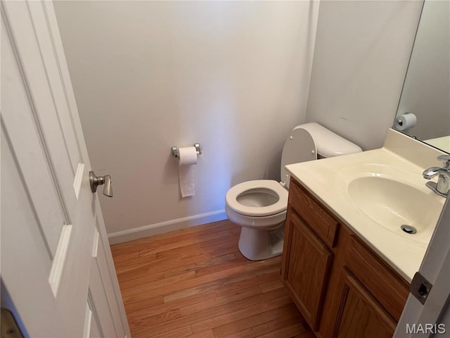 2828 Rutger St, Saint Louis, MO 63104 - bathroom featuring hardwood / wood-style floors, toilet, vanity, and baseboards