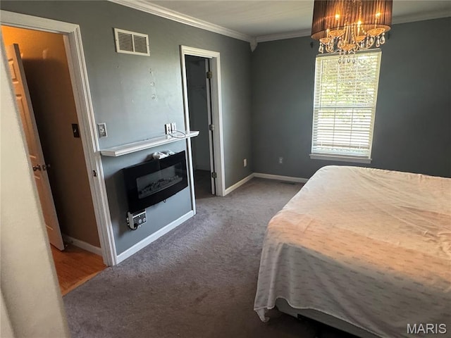 2828 Rutger St, Saint Louis, MO 63104 - carpeted bedroom with ornamental molding, a chandelier, and baseboards