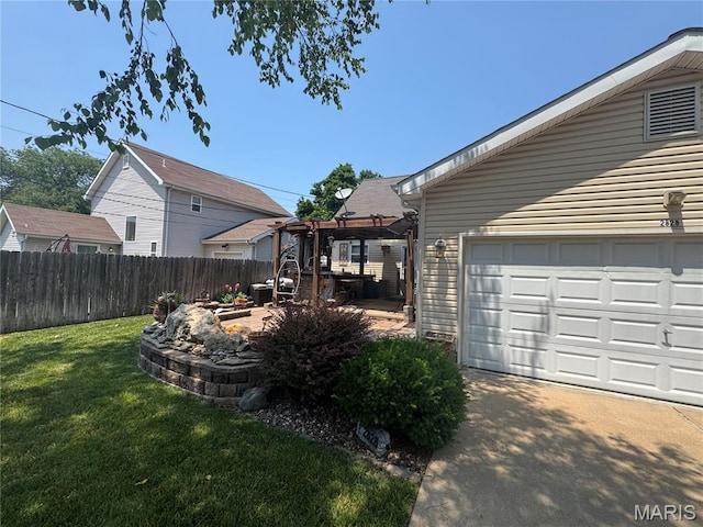2828 Rutger St, Saint Louis, MO 63104 - view of yard featuring a pergola and a garage