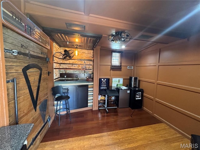 2828 Rutger St, Saint Louis, MO 63104 - office space with wood finished floors and a decorative wall
