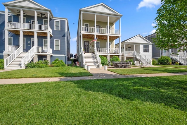 1017 Kilderkin Way, Saint Charles, MO 63301 - coastal inspired home featuring stairs, a ceiling fan, a balcony, and a front lawn