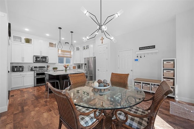 1017 Kilderkin Way, Saint Charles, MO 63301 - dining area with dark wood-style floors, recessed lighting, baseboards, and a chandelier