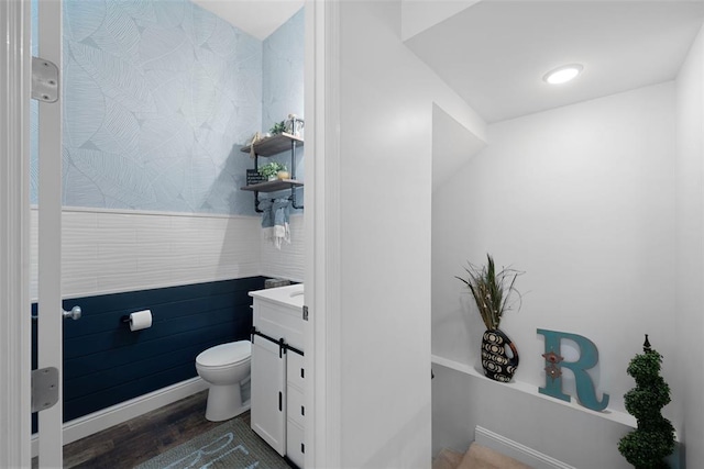 1017 Kilderkin Way, Saint Charles, MO 63301 - bathroom with toilet, wood finished floors, wainscoting, and vanity