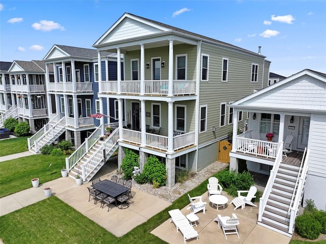 1017 Kilderkin Way, Saint Charles, MO 63301 - rear view of property with stairway, a lawn, a patio area, and a porch