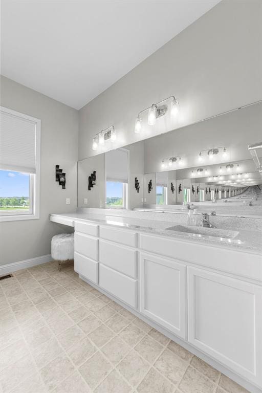 1017 Kilderkin Way, Saint Charles, MO 63301 - full bath featuring double vanity and baseboards