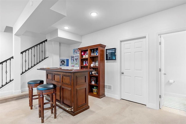 1017 Kilderkin Way, Saint Charles, MO 63301 - indoor dry bar featuring stairway, baseboards, recessed lighting, and light carpet