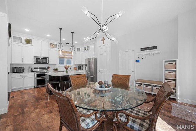 1017 Kilderkin Way, Saint Charles, MO 63301 - dining space featuring dark wood finished floors, recessed lighting, baseboards, and a chandelier