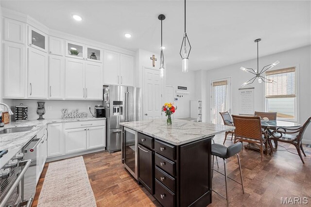 1017 Kilderkin Way, Saint Charles, MO 63301 - kitchen featuring high end fridge, a sink, white cabinetry, and recessed lighting