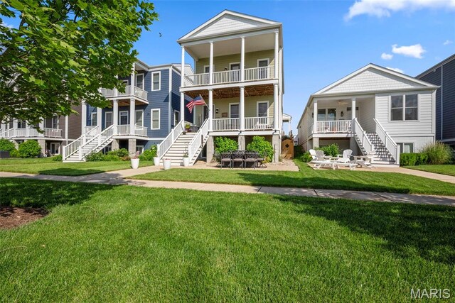 1017 Kilderkin Way, Saint Charles, MO 63301 - coastal inspired home with stairway and a front lawn