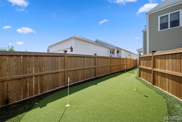1017 Kilderkin Way, Saint Charles, MO 63301 - fenced backyard featuring a putting area