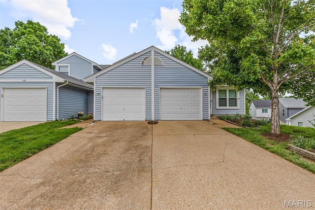 101 Carnegie Ct, Valley Park, MO 63088 - view of front of property featuring an attached garage, driveway, and an outbuilding