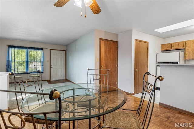 101 Carnegie Ct, Valley Park, MO 63088 - dining area featuring baseboards, a ceiling fan, and a skylight